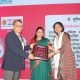 Dr. Sumita Prabhakar receiving Naari Samman Award for excellence in women's healthcare and fertility treatment in Dehradun
